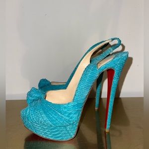 Christian Louboutin teal Embossed Slingback Platforms. Lightly worn.